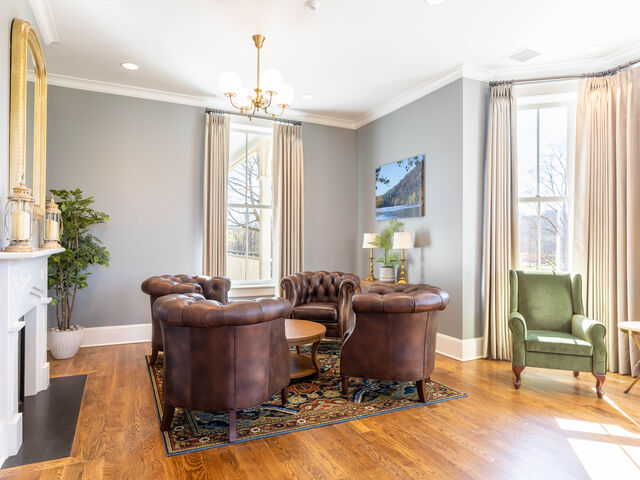 The Grayson Parlor at The Inn at Foster Falls — leather club-chair seating group